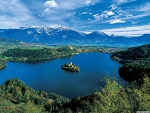 Фотографии Озеро Словения Небо Гора Природа